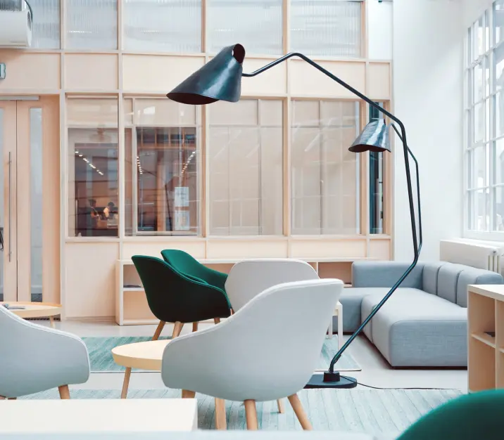 room with chairs and a lamp